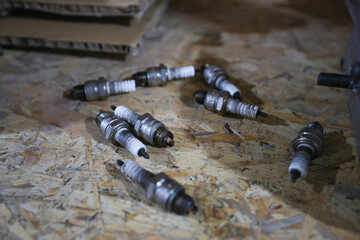 spark plug isolate on the wood background