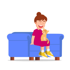 A little girl smiling on a sofa with a cat on her lap