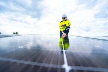 A skilled technician adjusts a solar panel on rooftop, emphasizing the transition to sustainable...