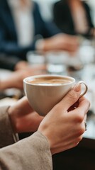 Morning Coffee Ritual: The hands gently cradle a ceramic mug filled with aromatic coffee. The scene is a perfect blend of everyday calm and sophistication, ideal for themes of relaxation, meetings.
