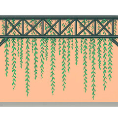 Overhanging green foliage suspended from a dark green structure against a peachy backdrop