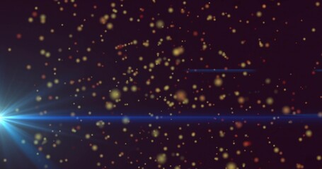 Bright blue lens flare shooting horizontal beam in purple space with glowing particles, copy space