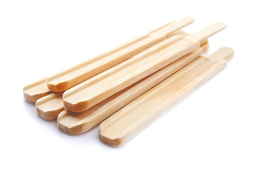 Pile of wooden popsicle sticks isolated on white background