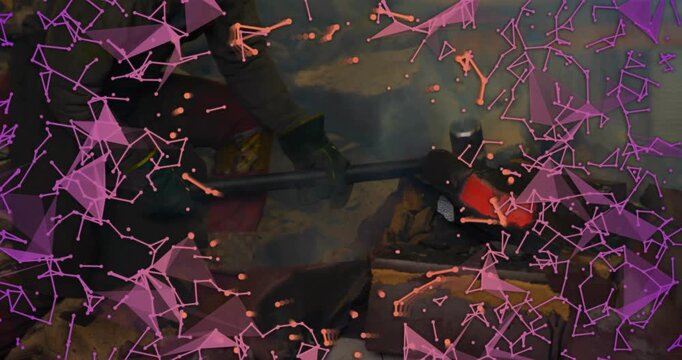 Dipping tip into glowing forge, blacksmith rotating rod for even heat amid pink overlays