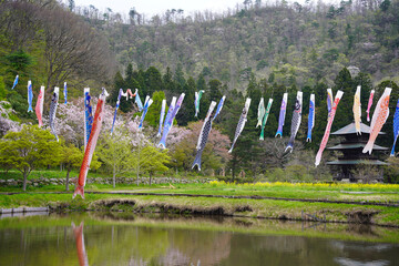 鯉のぼりと三重塔（山形県まほろば古の里歴史公園）/Japanese three stories pagoda with Japanese carp-shaped streamer