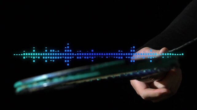 Hand gripping racket starting motion as waveform pulsating syncing highlighting string detail