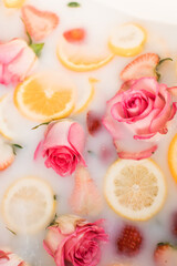 Oranges, Lemon and Strawberry Slices and pink roses in a milk bath photo session