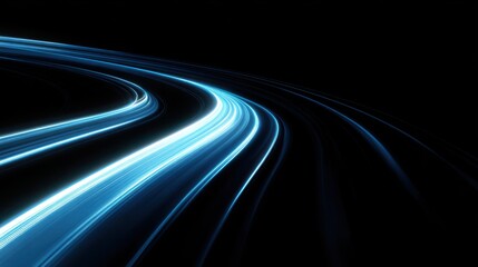 Abstract blue light streaks swirling in the darkness creating a sense of speed and motion