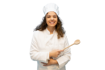 Young female chef in a crisp white uniform, smiling brightly while holding a wooden spoon against a transparent background