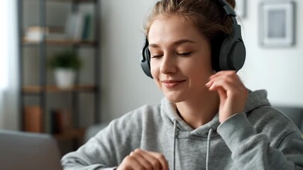 Close up student using headphones online lecture cinematic UHD handheld EdTech lifestyle stock footage. learner e learning audio lesson education ultra high definition handheld