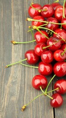 Freshly picked cherries on a rustic wooden surface