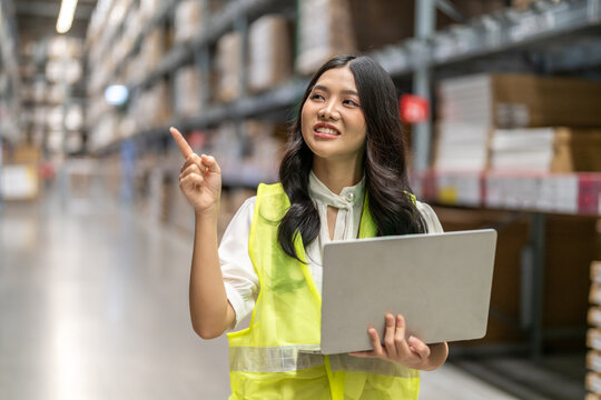 Female engineers discussing inventory in warehouse logistics and supply chain planning, operation management, data analysis, warehouse shipping, inventory tracking, optimization and technology