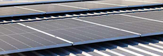 Blue solar panels on roof background. Solar power plant. Solar farm, blue solar module technology...