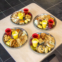 Food is first offered to deities during worship, then distributed as prasadam to participants. This act fosters spiritual connection and everyone receives a nutritious meal, selective focus