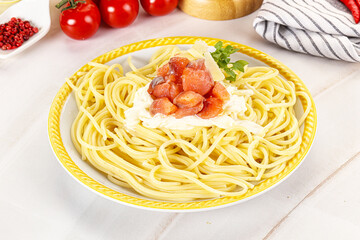Pasta spaghetti with salmon and stracciatella