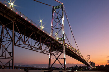 Florianópolis e o anoitecer na ponte Hercilio Luz com sua nova iluminação Florianopolis Santa Catarina Brasil