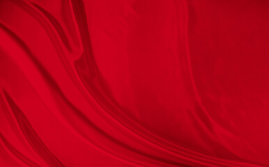 Black red satin dark fabric texture luxurious shiny that is abstract silk cloth background with patterns soft waves blur beautiful.