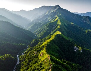 Obraz premium Mountain range vista, lush green valleys