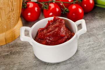 Red tomato paste in the bowl