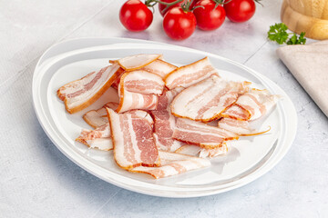 Raw pork tenferloin with bacon