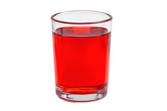 a glass of red liquid on a white background