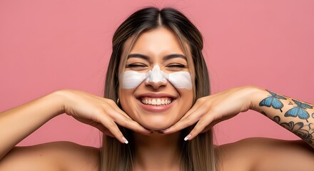 Smiling woman with a face mask and butterfly tattoo posing against a pink background