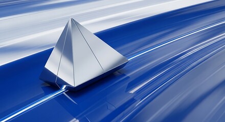 A metallic pyramid rests on a glossy, vibrant blue and white surface, showcasing a dynamic, modern design.