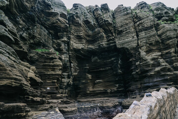 Scenery around Yongmeori Coast(Dragon head coast), a tourist attraction famous for Multistory layered rough and strange sedimentary rocks in Jeju Island, South Korea.