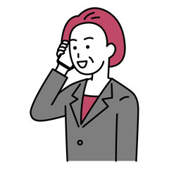 スマートフォンで話す中年のスーツの女性