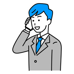 スマートフォンで話すスーツの男性
