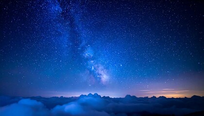 A panoramic view of a celestial nightscape, with the Milky Way galaxy shining brightly above rolling clouds