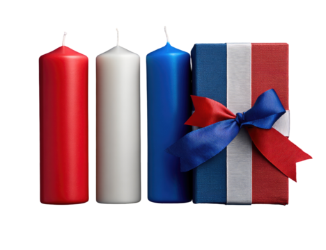 Three colored candles and a gift box with a ribbon