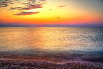Beautiful summer sunrise over the beach