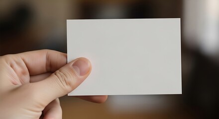 Obraz premium Blank card in hand presents opportunity for message and branding ideas