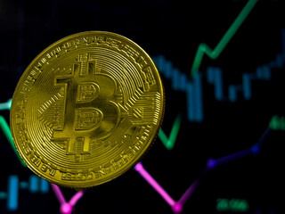 A gold coin with the letter B on it is floating in the air.
