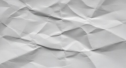 Obraz premium Abstract crumpled white paper texture with dramatic shadows and sharp folds
