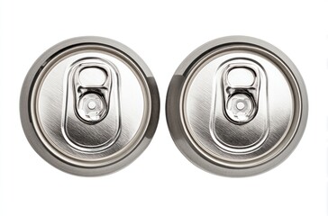 Overhead view of two shiny, silver aluminum beverage cans side by side, showing their tops with pull tabs, isolated on a white background