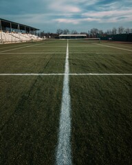 Obraz premium Professional Tennis Court with Freshly Painted Lines and Stadium Seating Modern Sports Facility for Premium Event Marketing and Organized Competition