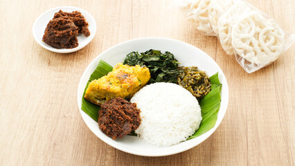 Nasi Padang or Nasi Kapau, rice with various side dishes rendang, egg, and sambal. Indonesian Food