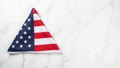 American flag folded into a triangle on marble background for Veterans Day  