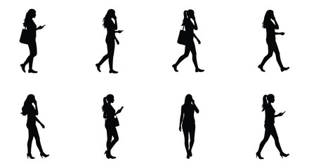 Silhouette of Businesswomen Walking and Talking on Phones or Using Mobile Devices