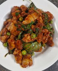 Stir-fried pork belly with curry paste. Pork belly stir-fried with curry paste. Thai food. Spicy. Pork with herbs. Thai food. Pork. Spices. Herbs   