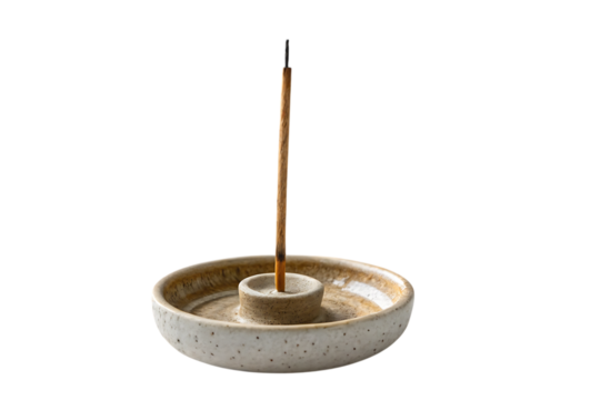 Burning incense stick in ceramic holder peaceful home vibes