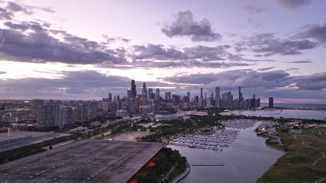 Aerial Drone Video of Downtown Chicago Skyline Over Lake Michigan at Sunset Stunning aerial drone footage of Downtown Chicago, Illinois, captured at sunset. This video highlights the iconic Chicago 