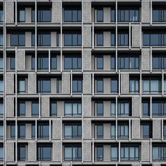 Obraz premium Modern Building Facade with Intricate Repetitive Geometric Patterns and Texture
