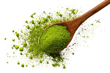Wooden spoon holds matcha powder, scattered on a backdrop
