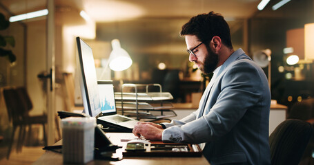 Business, night and man with computer, typing and internet for stats, financial agency and trading....