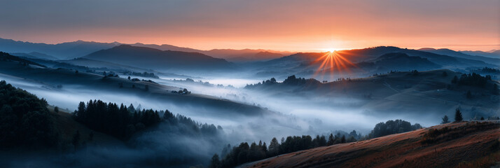 Obraz premium The sun is setting over a mountain range, casting a warm glow over the landscape