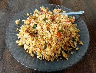 Traditional Indian Poha Breakfast with Vegetables