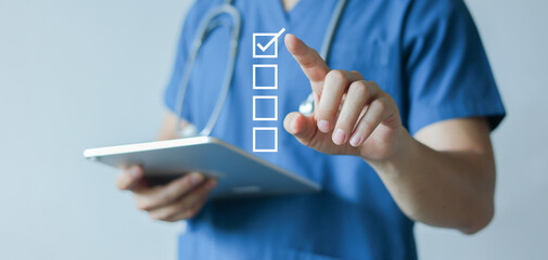 close up young general practitioner hand use stylus pen to check box on medical chekclist or opd record to read and diagnose and assess about patient's symptom for healthy and lifestyle concept